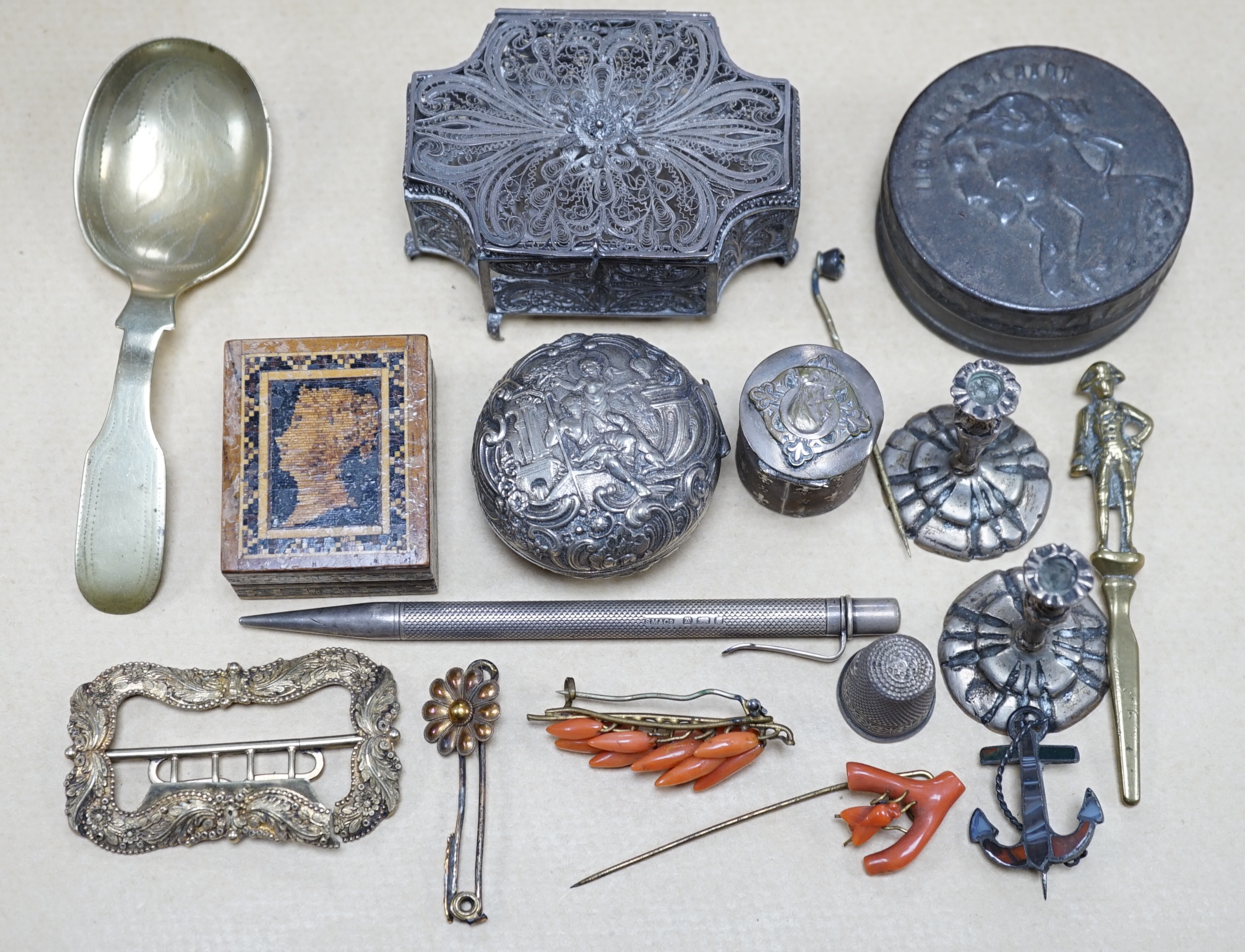 Objects of vertu and jewellery to include a carved coral stick, a pair of miniature candlesticks, a gilt metal shoe buckle, a Scottish hardstone anchor brooch and a Tunbridge ware stamp case. Condition - varies